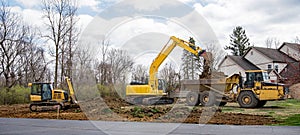 Land Excavation Panorama with Bulldozer, Backhoe and Truck