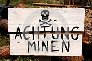 Land mines warning in German photo