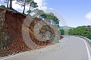 Land or mudslide on mountain road after storm