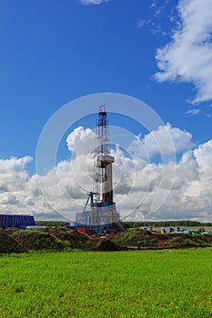 Land oil drilling rig blue sky