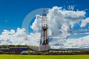 Land oil drilling rig blue sky