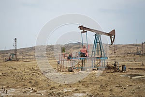 Land oil drilling rig blue sky .Land rig during the drilling operation . Oil and gas drilling rig onshore dessert with dramatic