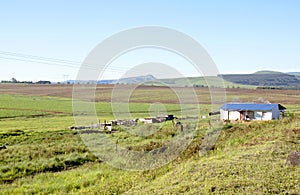 Land Prepared For Farming With African Hut In Foreground