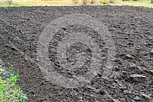 Land prepared for sowing. Plowed brown earth. Rural and agriculture concept. Spring mood.