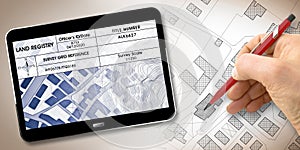 Land registry concept image with an imaginary cadastral map of territory with buildings, roads