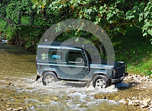 Land Rover crossing river