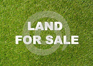 Land For Sale text written on green grass conceptual image of property investment and real estate