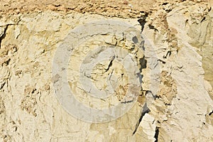 Land structure in open pit mining. Ground background in quarry. Rock texture during earthworks. Sand background and Earth`s crust