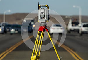 Land survey equipment set up on road photo