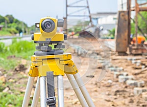 Land surveying equipment theodolite at construction site