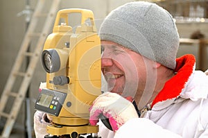 Land surveyor on construction site