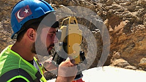 Land surveyor at construction site