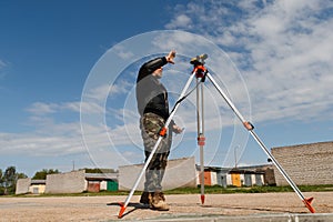 Land surveyor on construction site