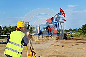 Land surveyor expert at work on an oil well