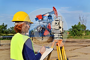 Land surveyor expert at work on an oil well