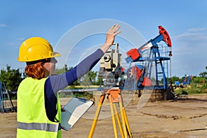 Land surveyor expert at work on an oil well