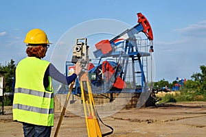 Land surveyor expert at work on an oil well