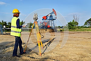 Land surveyor expert at work on an oil well