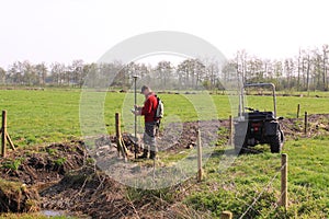 Land surveyor at work with gps