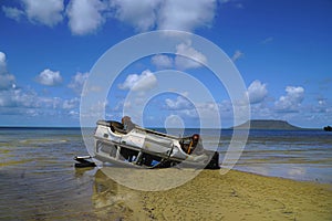 Landcruiser overturned on the beach