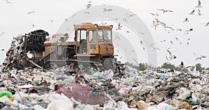 landfill. The contaminated land area is waste and garbage. green grass and garbage heaps. the problem of nature