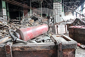Landfill of damaged gas masks in a dilapidated concrete building of an inactive enterprise.