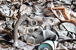 Landfill of damaged gas masks in a dilapidated concrete building of an inactive enterprise.