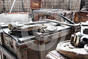 Landfill of damaged gas masks in a dilapidated concrete building of an inactive enterprise.