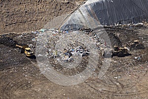 Landfill Machinery Working Area Compiling & Compacting Debris photo