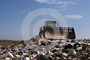 Landfill moving trash photo