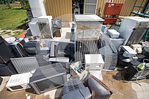 Landfill for used household appliances. Electrical waste for recycling photo