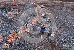 Landfill waste disposal. Garbage dump with waste plastic and polyethylene. Garbage truck unloads rubbish in landfill. Reduce