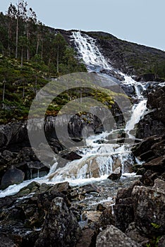 Landfoss Waterfall 2000 ft tall cascade flowing into Akrafjorden