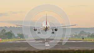 Landing aircraft at the airport of the city of Legazpi early in the morning. Philippines.