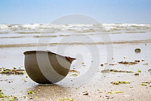 Landing beaches of june 6, 1944 in Normandy. Utah beach. Helmet of a parachutist on the sand. The longest day. photo