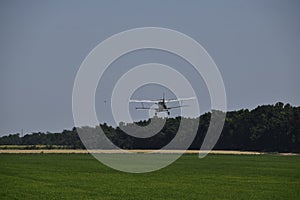 Landing on the field for filling fertilizers An-2.