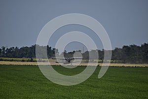 Landing on the field for filling fertilizers An-2.