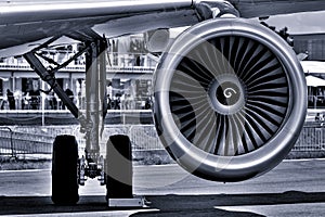 The landing gear and turbofan engine of passenger airliner.