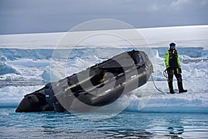 Landing an inflatable boat on the Antarctic sea ice, Weddell Sea, Antarctica