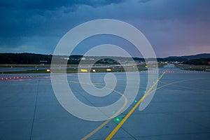 Landing lights at night on airport runway