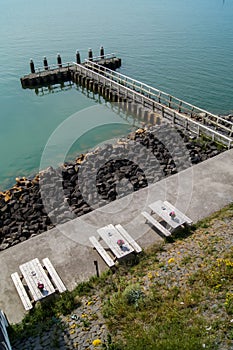 Landing pier on lake with Friesland flag