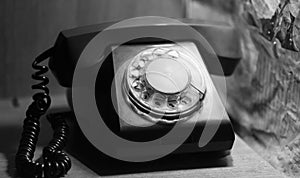 Landline old telephone, vintage background. Old disk telephone with the USSR Quality Mark of the last century