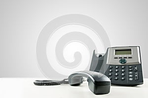 Landline telephone with the receiver off-hook photo