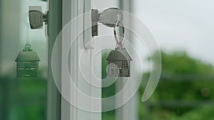 Landlord for new house concept. The house key for unlocking a new house is plugged into the door