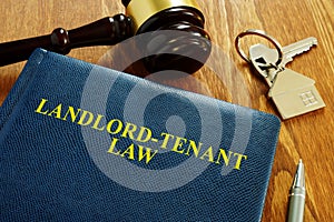 Landlord Tenant Law book and key photo