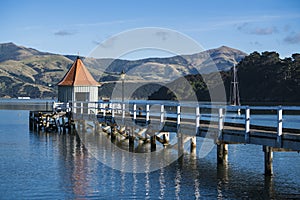 The landmark of Akaroa, Daly`s Wharf at sunset.