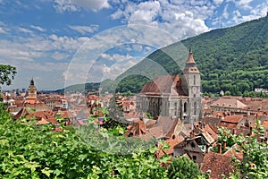 Landmark attraction in Brasov, Romania. Panorama over the old town with the imposing catholic Black Church (Biserica