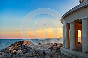 Landmark of Saint Theodore lighthouse in city of Argostoli at sunset, Kefalonia island, Greece