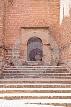 Stairs and door in Church San Mateo in Banos de la Encina photo
