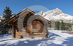 Landmark Wood Log Cabin  Chalet Emergency Shelter Snowy Mountain Peaks Landscape Banff National Park Canadian Rockies